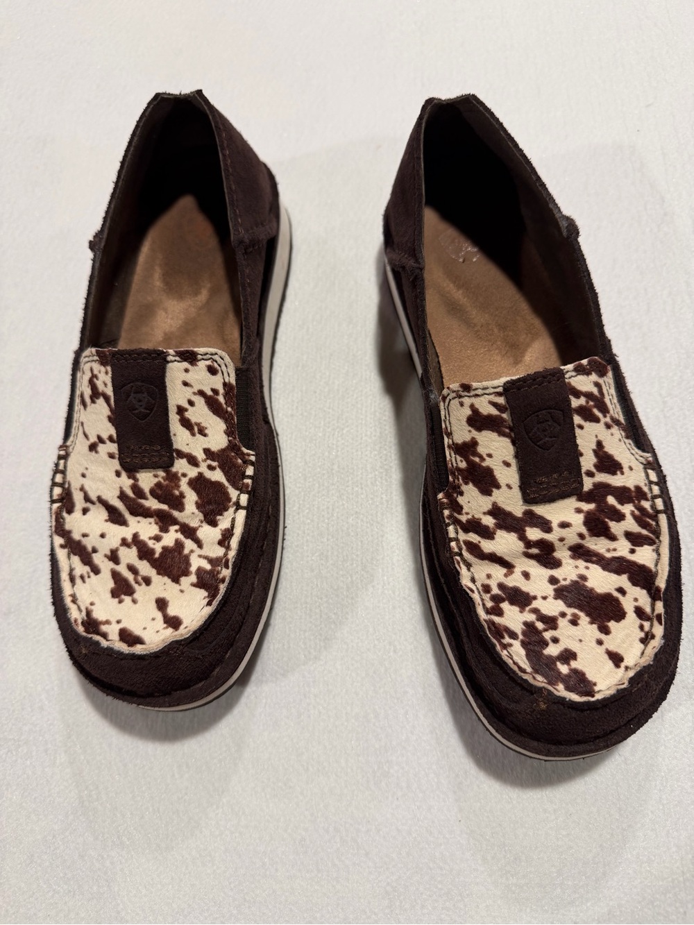 Ariat women’s Brown Cowprint Slip-On Shoes